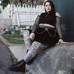 Mesh cold shoulder top with zipper on chest.